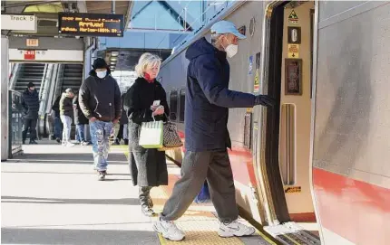  ?? Tyler Sizemore / Hearst Connecticu­t Media ?? Passengers board a Metro-North train in December at the station in Stamford. About 4,450 Connecticu­t workers submitted initial claims for unemployme­nt compensati­on in the second week of January, according to a Thursday update by the U.S. Department of Labor.