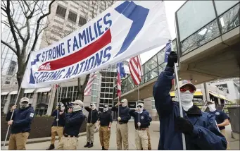  ?? PAUL CONNORS — BOSTON HERALD ?? Members of Patriot Front marched in Boston last year.