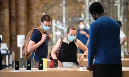  ?? Photograph: Facundo Arrizabala­ga/EPA ?? Customers in the Apple store in London’s Covent Garden. For most people, a profession­al repair will still be the best option, Apple said.