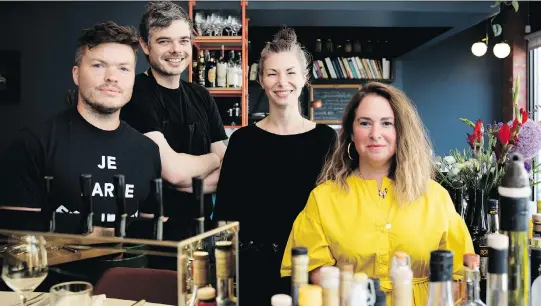  ?? PHOTOS: ALLEN McINNIS ?? Lawrence’s owners — Ethan Wills, left, Marc Cohen, Sefi Amir and Annika Krausz — are also behind Larrys wine bar and Boucherie Lawrence.