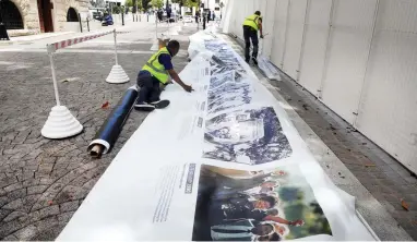  ?? PICTURE: CINDY WAXA/AFRICAN NEWS AGENCY (ANA) ?? DELAYED: Workers putting up the banner for the State of the Nation address. It was postponed yesterday.