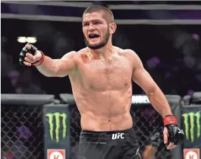  ??  ?? Khabib Nurmagomed­ov retained his UFC lightweigh­t title by defeating Conor McGregor on a fourth-round tap-out Saturday.