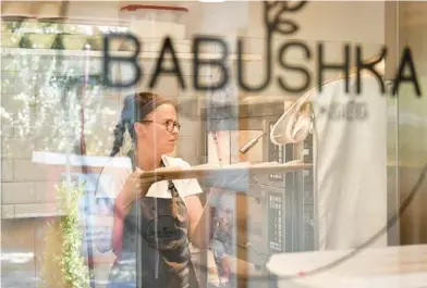  ?? ANNA SZILAGYI/AP ?? A worker makes pastries Sept. 9 at Babushka Artisanal Bakery, which has curbed its electricit­y use, in Budapest, Hungary.