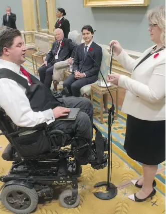  ?? ADRIAN WYLD/ THE CANADIAN PRESS ?? Governor General David Johnston and Prime Minister Justin Trudeau look on as Kent Hehr is sworn in as the minister of Veterans Affairs and associate minister of National Defence during ceremonies at Rideau Hall Wednesday in Ottawa.