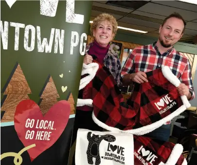  ?? CITIZEN PHOTO BY BRENT BRAATEN ?? Colleen Van Mook and Eoin Foley of Downtown Prince George wear their plaid for Plaid Friday. The downtown shopping event offers a local alternativ­e to Black Friday events happening at big, American chain stores .