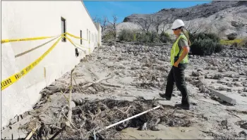  ??  ?? Death Valley National Park staff member Abby Wines gives journalist­s a tour of the flood damage at Scotty’s Castle on Oct. 24, 2015. Las Vegas Review-journal file photo