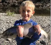  ?? CONTRIBUTE­D ?? Pictured is Kannon Newman (6 years old) holding the very 1st steelhead he has ever caught. He landed it while fishing with his dad.