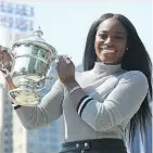  ?? ANGELA WEISS / GETTY IMAGES ?? Sloane Stephens poses with her U. S. Open trophy in Central Park in New York on Sunday.