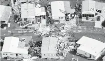  ?? AL DIAZ adiaz@miamiheral­d.com ?? An aerial view of the damaged homes from Hurricane Ian seen in the vicinity of Fort Myers in September 2022.