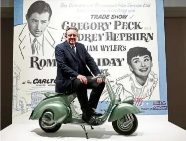  ?? — Reuters ?? Ferrer, poses on the Vespa scooter his mother, actress audrey Hepburn, rode on in the 1953 movie Roman Holiday at the exhibition Intimate Audrey in Brussels.
