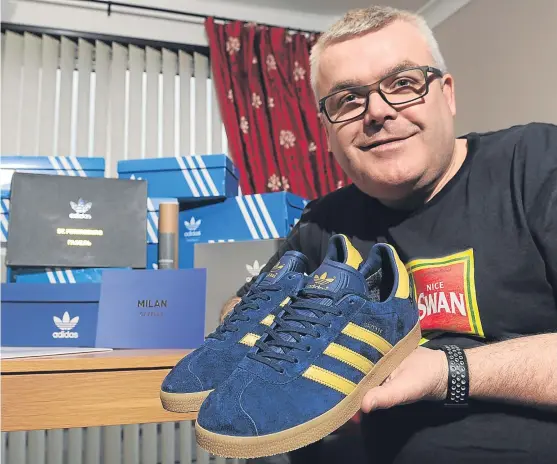 ?? Picture: Kim Cessford. ?? Collecter Alan Stewart with a pair of the coveted trainers at his Perth home.