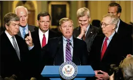  ?? J. SCOTT APPLEWHITE / AP ?? Lindsey Graham, R-S.C., is flanked by (from left) Sens. Roy Blunt, R-Mo.; Majority Whip John Cornyn, R-Texas; John Barrasso, R-Wyo.; Bill Cassidy, R-La.; Majority Leader Mitch McConnell, R-Ky.; and Sen. John Thune, R-S.D., at the Capitol Tuesday.