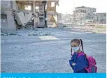  ?? ?? RAQQA: A Syrian student walks to school past damaged buildings in the northern city of Raqqa, on September 23, 2021. —AFP