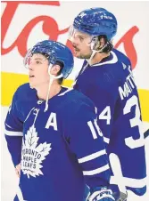  ?? NATHAN DENETTE THE CANADIAN PRESS ?? Mitch Marner, left, and Maple Leafs teammate Auston Matthews hang their heads after being knocked out of the playoffs.