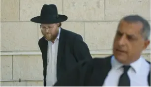  ??  ?? AHARON KORLANDSKI arrives at the Jerusalem District Court on Sunday.