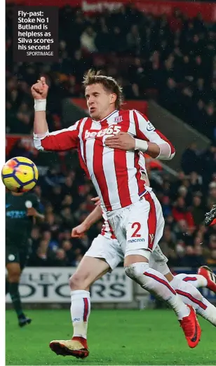  ?? SPORTIMAGE ?? Fly-past: Stoke No 1 Butland is helpless as Silva scores his second
