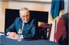  ?? MONEYMAKER/THE NEWYORKTIM­ES ANNA ?? Sen. Chuck Schumer listens to reporters Wednesday during a virtual meeting with President-elect Joe Biden’s economic team.