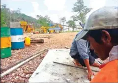  ?? SUPPLIED ?? Community members work near a quarry on forestland that they accuse RCAF officials of grabbing in Oddar Meanchey province.