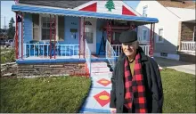  ?? CARLOS OSORIO — THE ASSOCIATED PRESS ?? Samih Zreik stands in front of his house in Dearborn. Zreik painted his house in tribute to Lebanon following the blast at Beirut’s port that killed nearly 200people, wounded more than 6,000and caused billions of dollars in damage.