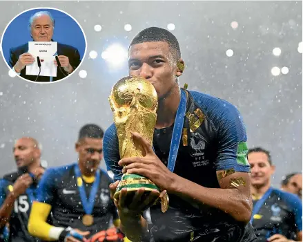  ?? GETTY IMAGES, AP ?? France’s Kylian Mbappe kisses the World Cup trophy after winning the 2018 tournament in Russia. Inset: Former Fifa boss Sepp Blatter reveals Qatar as hosts of the 2022 World Cup after a vote in Zurich in 2010.