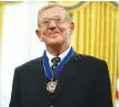  ?? AP PHOTO/ EVAN VUCCI ?? Former football coach Lou Holtz smiles after receiving the Presidenti­al Medal of Freedom from President Donald Trump in the Oval Office on Thursday.