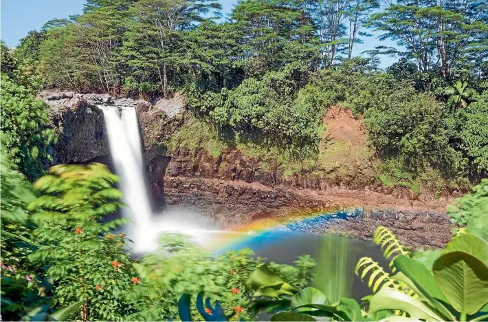  ?? PHOTOS: BROOK SABIN ?? At around 10.30am, Rainbow Falls on the Big Island of Hawai’i puts on a spectacula­r display.