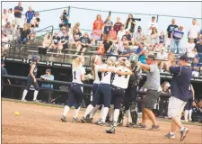  ?? STAFF PHOTO BY MICHAEL REID ?? The La Plata softball team celebrates its 2A state softball title following its 9-1 win over Catoctin in Friday’s Class 2A state championsh­ip game at the University of Maryland’s Robert E. Taylor Stadium in College Park.