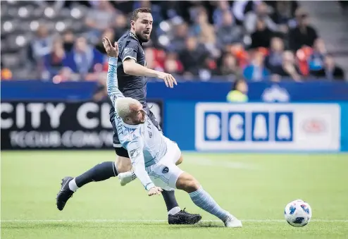  ?? — PHOTOS: THE CANADIAN PRESS ?? Jordon Mutch, shown here fighting for the ball with Sporting Kansas City’s Yohan Croizet, front, says he was confused by media stories saying there was dissension in the Whitecaps’ locker-room.