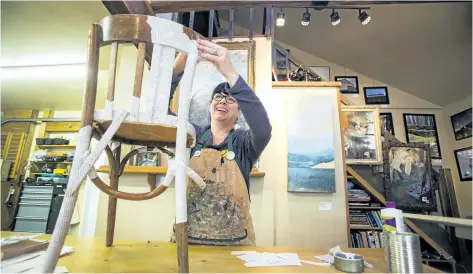  ?? JULIE JOCSAK/STANDARD STAFF ?? Michelle Morrissey is photograph­ed by a chair she has decorated in her Ridgeway studio for the Chair Affair Auction that will raise funds for the Niagara Furniture Bank on Thursday.