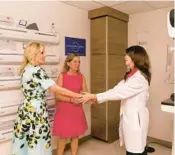  ?? MATIAS J. OCNER/THE MIAMI HERALD ?? From left, first lady Jill Biden and U.S. Rep. Debbie Wasserman Schultz greet Dr. Monica Yepes, the chief of breast radiology at Sylvester Comprehens­ive Cancer Center, during a tour of the center on Oct. 15.