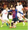  ?? LLUIS GENE/AFP ?? Lionel Messi scores against Eibar at the Camp Nou on Sunday, his 400th La Liga goal.