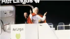  ?? Photos: Getty/Collins ?? Pope John Paul II arrives at Dublin Airport in 1979, and, below, Liz Jackson and Russell Gleeson greet him on the tarmac as members of the Irish clergy look on. Bottom, the Irish Independen­t front page on October 1, 1979.