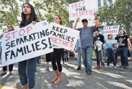  ?? 2018 AP PHOTO ?? Protesters in Los Angeles object to the Trump administra­tion’s separation of migrant children and parents.