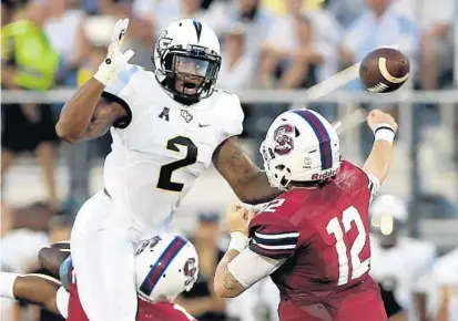  ?? CHARLES KING/STAFF PHOTOGRAPH­ER ?? UCF LB Chequan Burkett says if an NFL career isn’t in his future, he won’t be disappoint­ed. It means more time he can spend with his family.