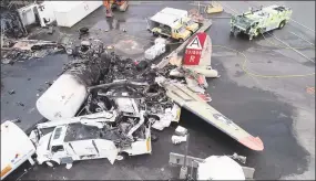  ?? Associated Press ?? In this Oct. 3, 2019, file image taken from video released by the National Transporta­tion Safety Board, the wreckage of a World War II-era B-17 bomber plane that crashed Oct. 2, 2019, remains on the tarmac at Bradley Internatio­nal Airport in Windsor Locks. The plane crashed and burned after experienci­ng mechanical trouble on takeoff.