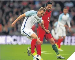  ??  ?? Harry Kane evades Joao Moutinho at Wembley.