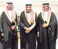  ??  ?? The new economy and planning minister, Mohammad alTuwaijri (right) and the new national guard chief, Prince Khalid bin Ayyaf al-Muqrin (left), pose for a photo with King Salman during a swearing-in ceremony in Riyadh, Saudi Arabia yesterday.