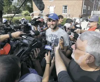  ?? Darron Cummings/Associated Press ?? When you’re the highest-paid player in the league, your arrival at training camp is going to be a major media event as it was for Andrew Luck Tuesday in Anderson, Ind.