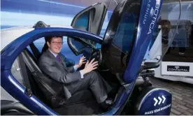  ?? Photograph: Anthony Upton/PA ?? Greg Clark, the business secretary, tries out a self-driving pod at a Society of Motor Manufactur­ers and Traders event in London.
