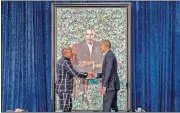  ?? [AP PHOTO] ?? Former President Barack Obama, right, and artist Kehinde Wiley shake hands Monday as they unveil Obama’s official portrait at the Smithsonia­n’s National Portrait Gallery in Washington.