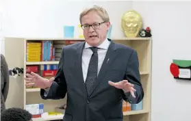  ?? RYAN JACKSON/ EDMONTON JOURNAL ?? Education Minister David Eggen speaks to students at St. Catherine School Tuesday, where he pledged continued financial support for schools.