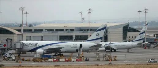  ??  ?? WILL ALIYA increase? Two planes at Ben-Gurion Internatio­nal Airport wait on the tarmac.