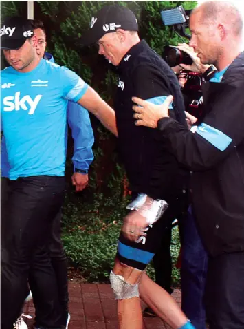  ??  ?? Britain's Christophe­r Froome injured arrives at his hotel in Marcq-en-Baroeul. Defending champion Chris Froome crashed out of the Tour de France today after falling twice on a wet and treacherou­s 152,5 km fifth stage of the 101st edition of the Tour de...