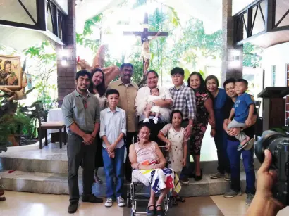  ??  ?? THE Afdal Family pose for a souvenir photo after the baptismal rites