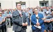  ?? TERRY/ THE OKLAHOMAN] ?? Oklahoma City Fraternal Order of Police Lodge No. 123 President John George, at right, and Vice President Mark Nelson speak during a news conference Tuesday. [BRYAN