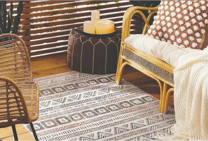  ??  ?? Outdoor carpets, soft pillows, screens, drapes and candleligh­t are ways to create a warm and inviting patio on cool autumn nights. Artefact Vinyl Rug, $90, Simons.ca