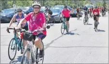  ?? ADAM MACINNIS/THE NEWS ?? Tony Corbin talks with youth about bicycle safety at the Heartland Tour event at the Pictou County Wellness Centre on Wednesday.