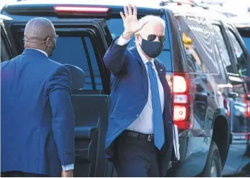  ?? ALEX BRANDON AP ?? President-elect Joe Biden waves as he arrives for a meeting with Vice President-elect Kamala Harris, Senate Minority Leader Chuck Schumer and House Speaker Nancy Pelosi on Friday in Wilmington, Del.