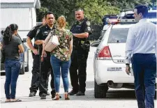  ?? Jay R. Jordan / Houston Chronicle ?? Relatives of a 9-month-old girl who died after being left inside a hot truck in Baytown speak with Harris County Sheriff Ed Gonzalez on June 4.