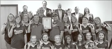  ?? Adam Cook ?? Fort Oglethorpe’s mayor and City Council pose for a photo with the Lakeview Middle School Lady Warriors softball team and coaches during its Oct. 14 meeting. The city issued a proclamati­on recognizin­g the team’s outstandin­g 2019 season.